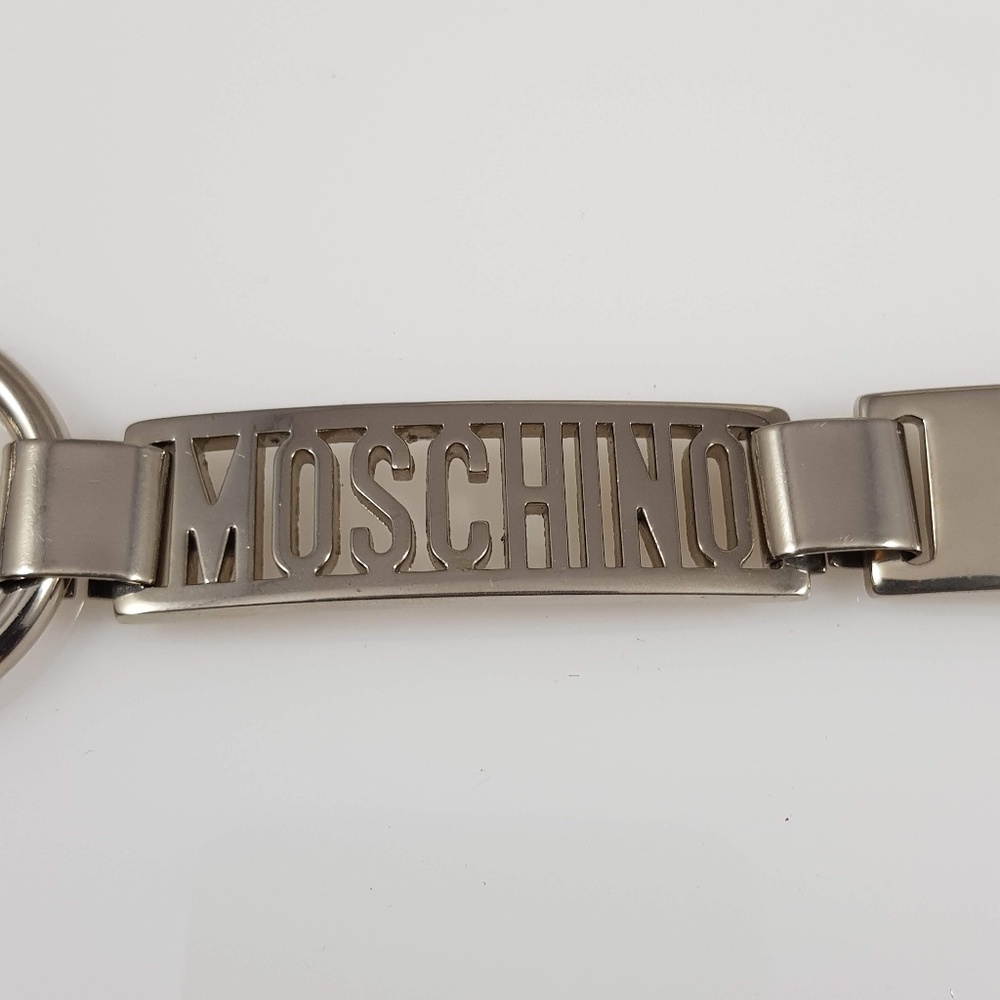 MOSCHINO SILVERTONE LOGO EMBELLISHED CHAIN BELT
